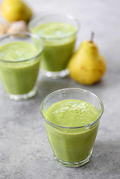 A refreshing green smoothie made from pear, ginger, and spinach 