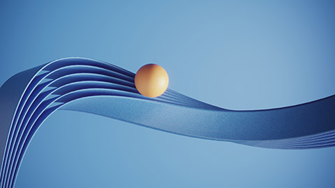 A 3-D image of a ball rolling along a blue ribbon track.