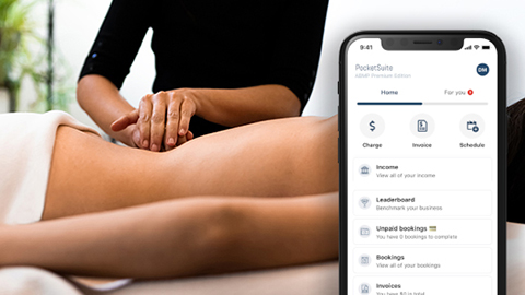 A massage therapist works on their client with an image of the PocketSuite app in the forefront.
