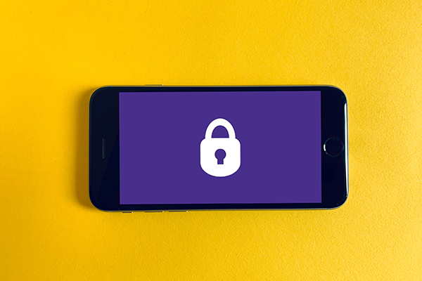 A smartphone with a purple screen and lock icon against a yellow background.