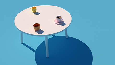 Three coffee cups rest on a round white table set against a blue background.