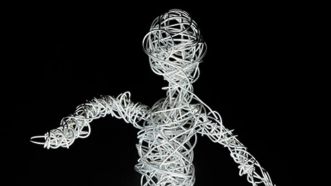 A bundle of white wires shaped into a human form. 