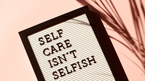 A sign saying self care isn't selfish.