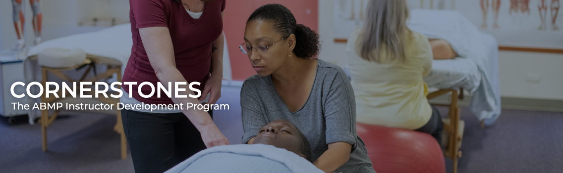 A massage instructor teaching an ABMP Student