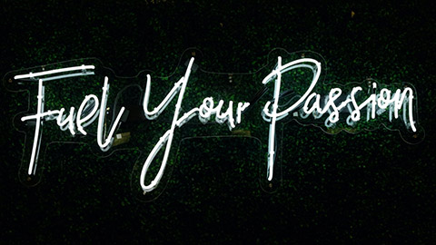 "Fuel Your Passion" written in neon. 