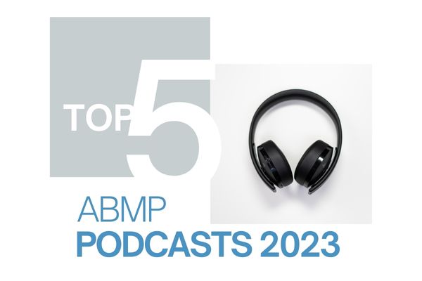 Headphones displayed graphically with Top 5 ABMP Podcasts 2023.