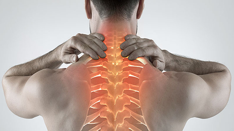 A man holding his neck with an animated image of his spine.